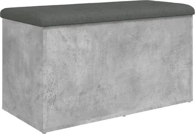 A rectangular storage bench with a dark gray cushioned top and a concrete-effect textured body.
