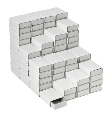 A stack of white matchboxes arranged in a stepped pattern.