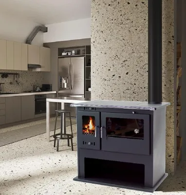 A modern kitchen with a wood-burning stove.
