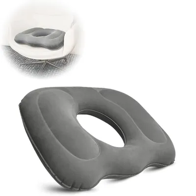 A gray inflatable seat cushion with a hole in the center, shown on a white background. A smaller inset image shows the cushion placed on a chair.