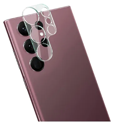 A close-up shot of a smartphone's camera lens protector being placed on the back of a purple smartphone.