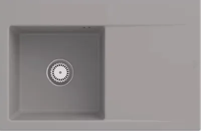 A top-down view of a gray kitchen sink with a drain.