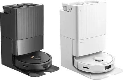 Two robot vacuum cleaners with docking stations, one white and one black, are displayed side-by-side against a white background.