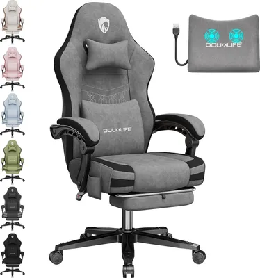 A grey gaming chair with a footrest and lumbar support pillow is displayed prominently, with several other colored chairs lined up on the left side of the image. A separate massage pillow with a USB cable is also shown.