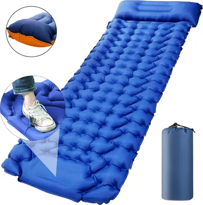A blue inflatable sleeping mat with a built-in pillow, shown inflated and with a foot pressing on a valve to inflate it. A rolled-up sleeping mat is also shown.
