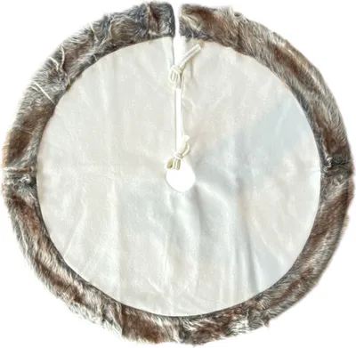 A round tree skirt with a faux fur trim is laid flat on a white background.