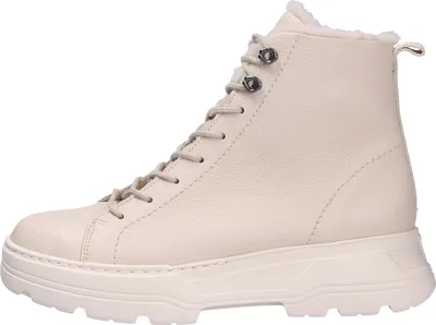 A side view of a beige boot.