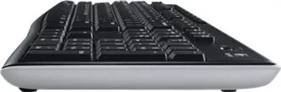 Side view of a black and gray wireless keyboard.