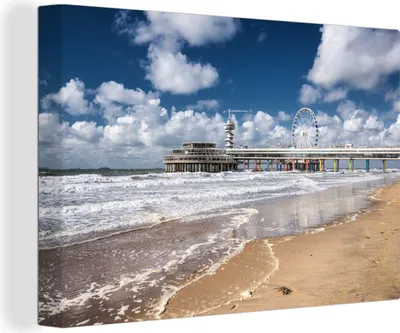 Produktbild von MuchoWow® - Leinwandbilder - Die Seebrücke und der Strand von Scheveningen, die Niederlande, Wandbild, Wanddeko Bilder Wohnzimmer, 120x80 cm