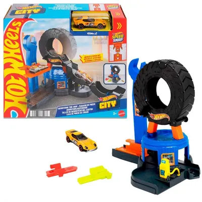 Produktbild von Hot Wheels City Downtown Reifenwerkstatt Spielset mit Spielzeugauto im Maßstab 1:64, mit dem Track-Schnellstecksystem kompatibel, Fahrzeug- & Schienen-Set, 3 Jahr(e), Kunststoff, Mehrfarbig