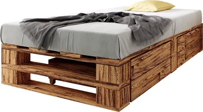 A bed frame made of wooden pallets with a mattress, blanket, and pillow.