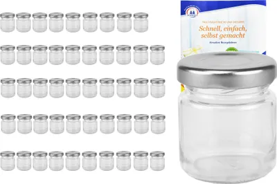 A collection of small glass jars with silver lids, arranged in rows, with a single jar and a recipe booklet shown separately on the right.