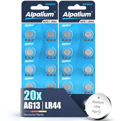 Two blister packs of button cell batteries are shown, with a single battery in the foreground.