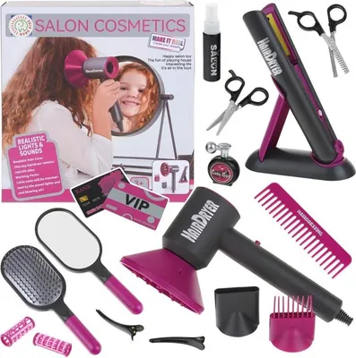 A collection of toy hair salon accessories, including a hairdryer, straightener, brushes, rollers, clips, and pretend cosmetics, arranged around a product box.