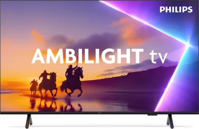 A television screen displaying a scene of people riding horses on a beach at sunset, with abstract light beams emanating from the top right corner.