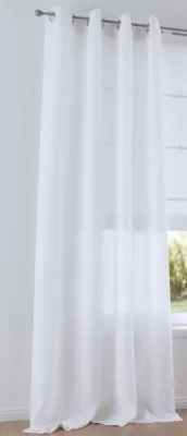 A white linen curtain hangs from a curtain rod, covering a window.