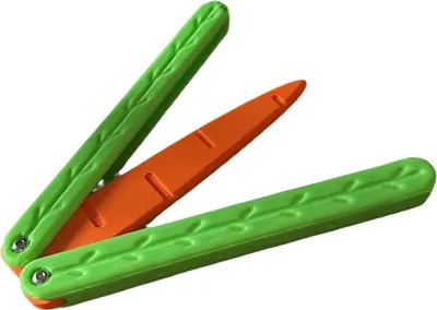 A toy knife shaped like a carrot, with green handles and an orange blade, is shown against a white background.