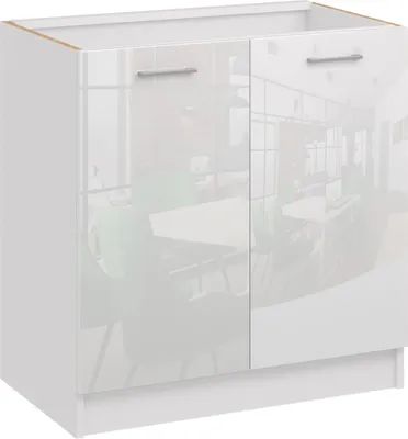 A white kitchen cabinet with two doors and silver handles, reflecting a room with tables and chairs.