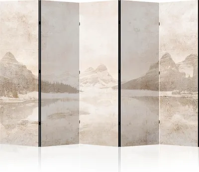A room divider with a winter mountain landscape print.