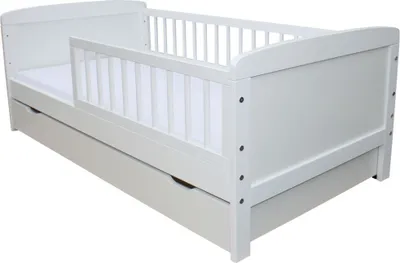A white children's bed with a mattress and a pull-out drawer underneath.