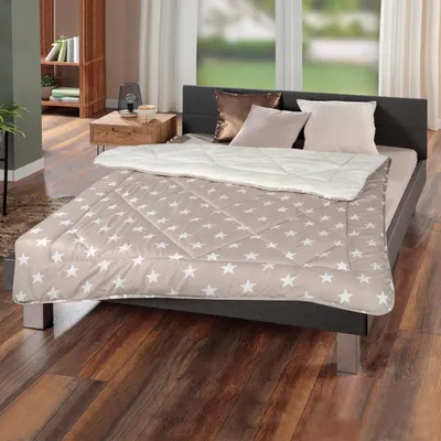 A bedroom scene with a bed made up with a duvet and pillows, next to a nightstand and a bookshelf.