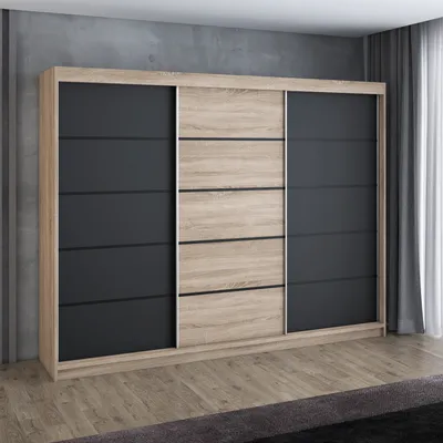 A modern sliding door wardrobe with a wood and black finish, set against a textured gray wall and a wooden floor.