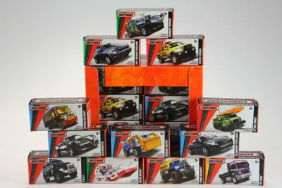 A pyramid-like arrangement of toy car boxes.
