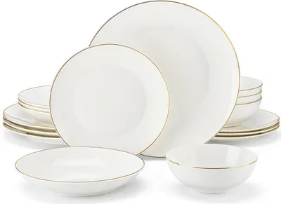 A set of white ceramic plates and bowls with gold trim, arranged on a white background.