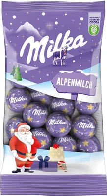 A bag of Milka Alpenmilch chocolate balls with a Christmas theme, featuring Santa Claus and snowy mountains.