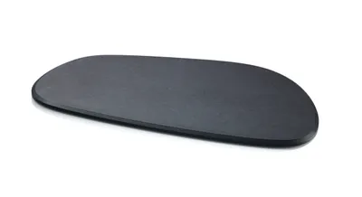 A dark gray, oval-shaped cutting board is shown on a white background.