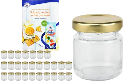 A set of small glass jars with gold lids and a recipe booklet.