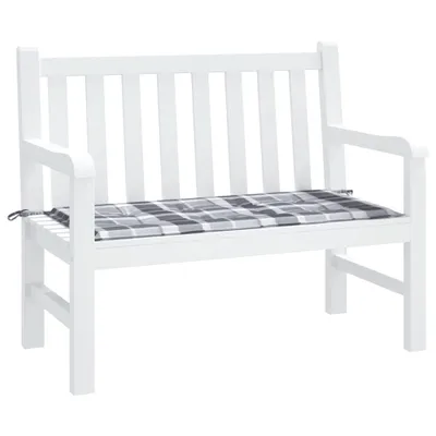 A white garden bench with a gray checkered cushion.