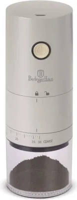 A portable coffee grinder with a clear container at the bottom filled with ground coffee.