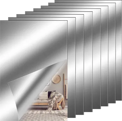 A stack of reflective mirror sheets, with one sheet peeled back to reveal a glimpse of a room interior.