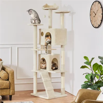 A multi-level cat tree with several cats on it, placed in a room with furniture and a clock on the wall.