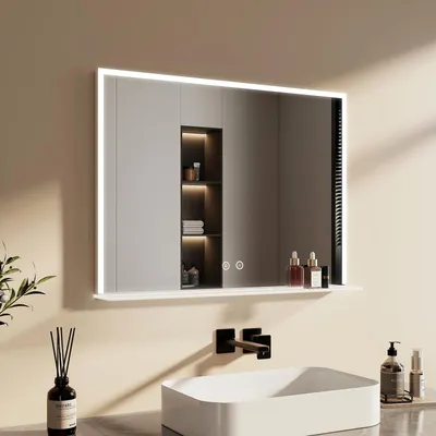 A modern bathroom with a sink and a lighted mirror above it.