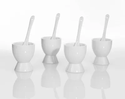 Zdjęcie produktu dla Podstawki na jajko z łyżeczkami porcelanowe białe 4 szt.