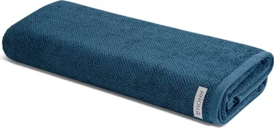 A folded teal towel is shown on a white background.