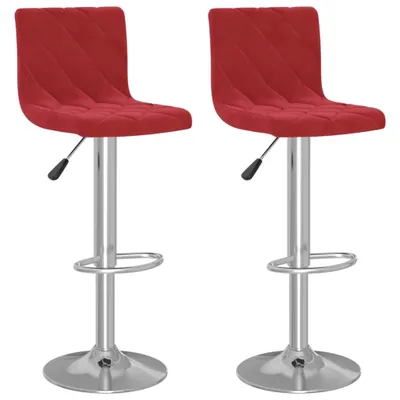Two red velvet bar stools on a white background.