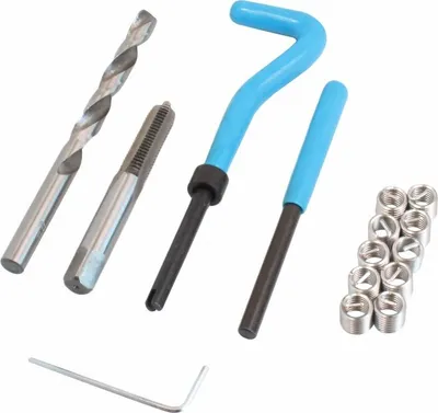 A set of tools for repairing threads, including a drill bit, a tap, two insertion tools, and several threaded inserts.