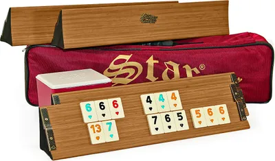 A Rummy/Okey game set with wooden racks and tiles, along with a red carrying bag and wooden storage boxes.