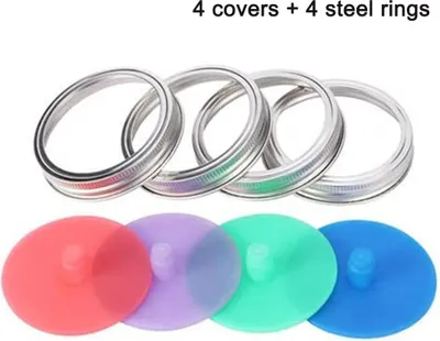 Four silver metal rings and four colored silicone lids for mason jars, arranged in two rows.