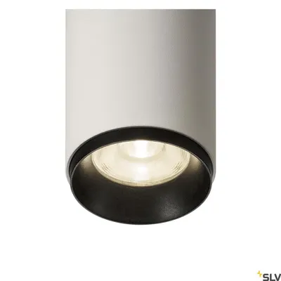 A close-up shot of a white cylindrical pendant light with a black inner rim and a lit LED bulb.