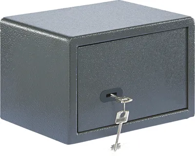 A small, dark gray safe with a key inserted into the lock.