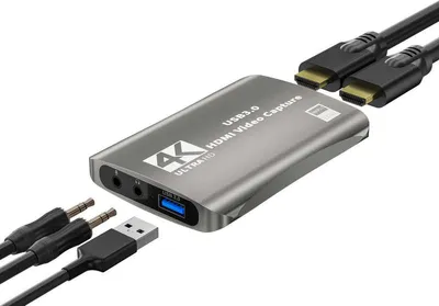 A 4K HDMI video capture card with connected cables is shown against a white background.