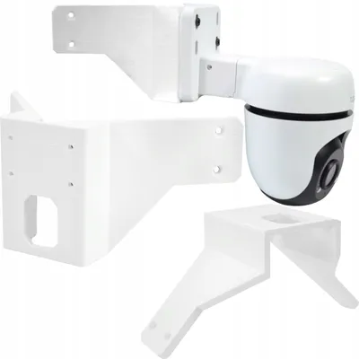 Three white mounting brackets for a security camera are displayed against a white background. One bracket is attached to a white security camera.