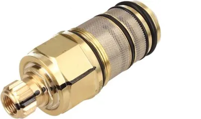 A close-up studio shot of a brass plumbing valve cartridge against a white background.