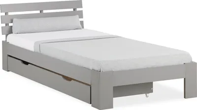 A single bed with drawers underneath, shown from a side-angle.