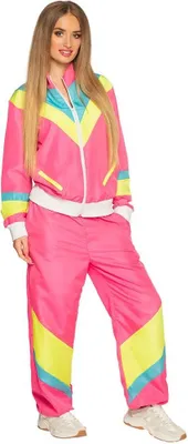 A woman is posing in a colorful tracksuit.