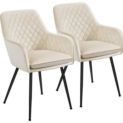 Two cream-colored chairs with diamond quilting and black metal legs are shown against a white background.